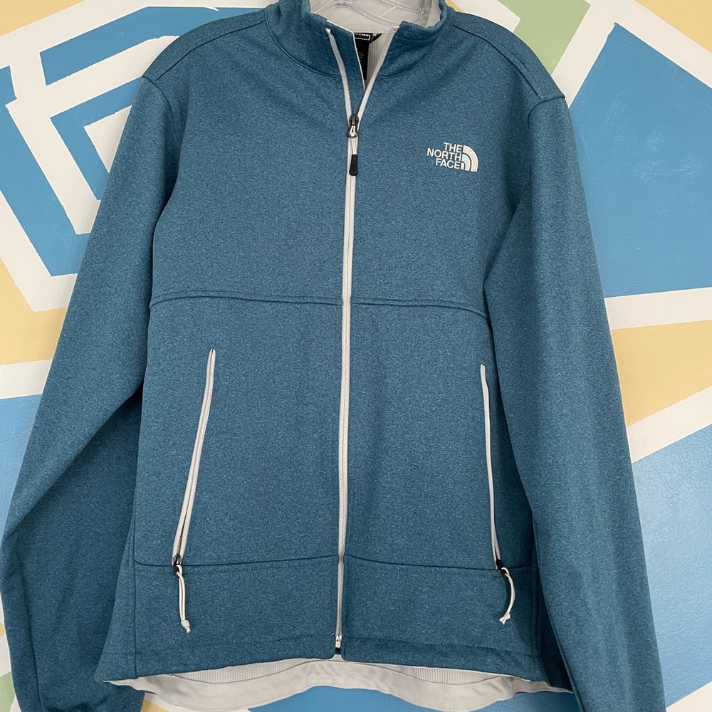 Blue north face zip-up.